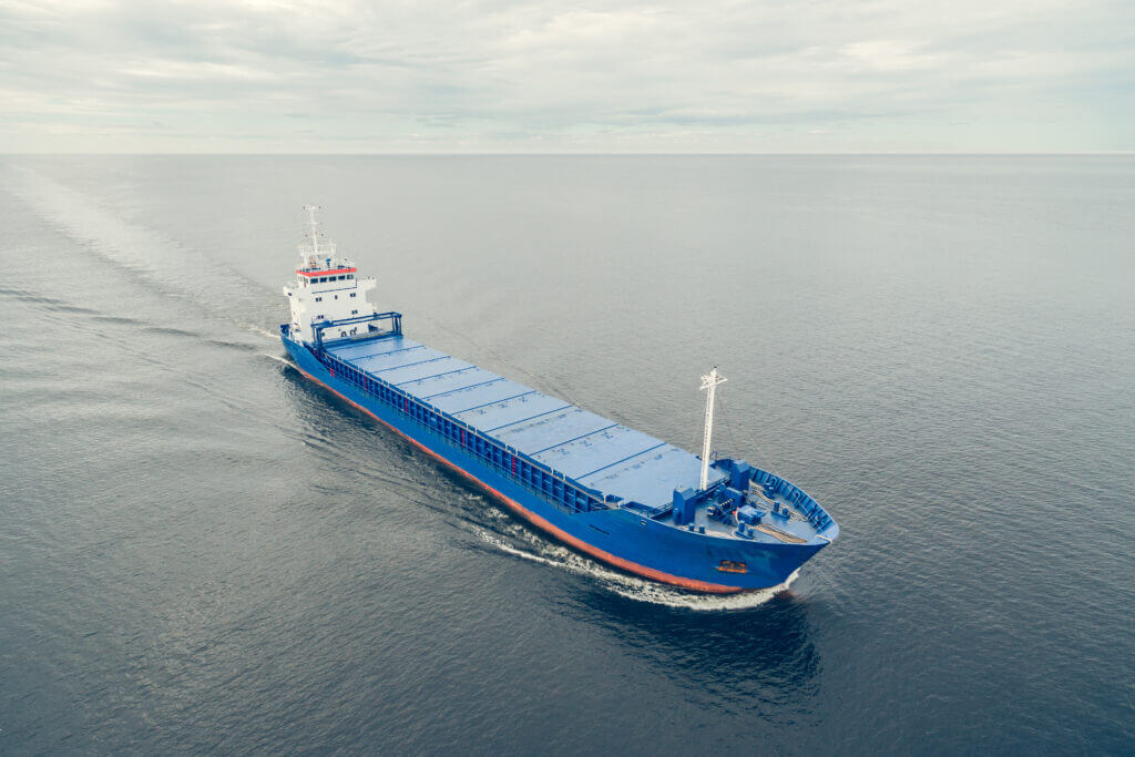 Aerial,View,Of,General,Cargo,Ship,In,Open,Sea